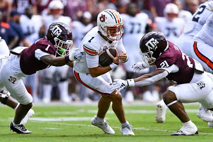 Auburn Tigers quarterback Payton Thorne (1) is tackled by Texas A&M Aggies defensive back Bryce Anderson (1) and linebacker Taurean York (21) during the first quarter at Kyle Field.